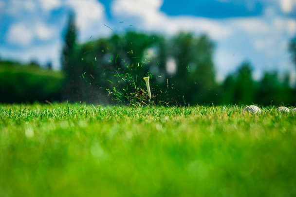 Playing golf. Golf course. Golf tee after shot. - Photo, Image