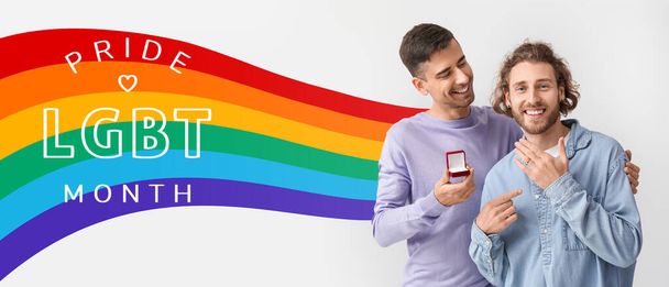 Young gay proposing to his boyfriend on light background. Celebration of LGBT Pride Month - Photo, Image
