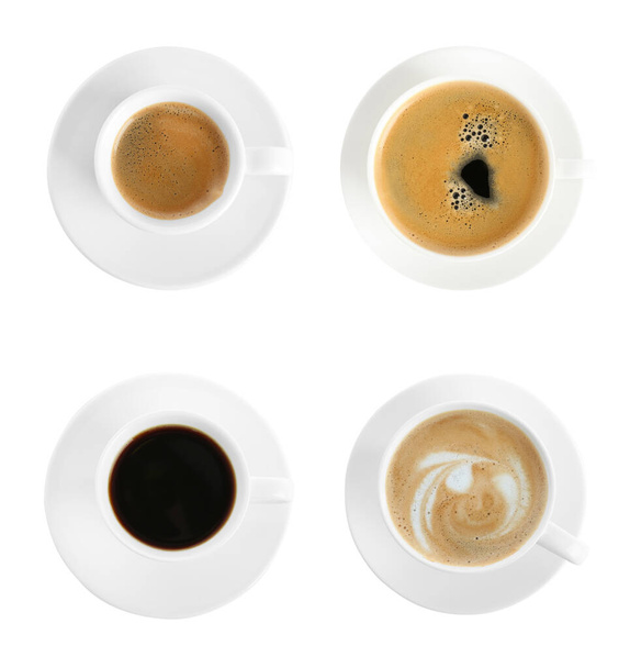 Set with cups of hot aromatic coffee on white background, top view - Foto, Bild
