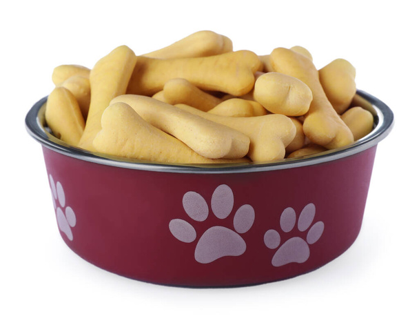 Bone shaped dog cookies in feeding bowl isolated on white - Fotoğraf, Görsel
