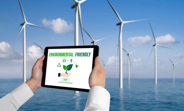 Зелена трансформація бізнесу для збереження навколишнього середовища та концепція бізнесу ESG. Бізнесмен використовує планшет для встановлення корпоративної мети щодо екологічного управління та альтернативного використання чистої енергії
. - Фото, зображення