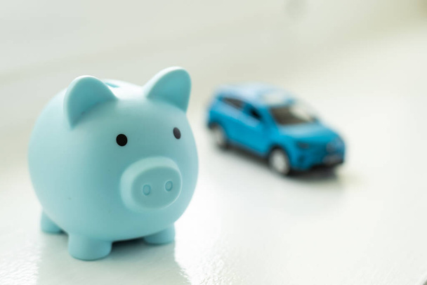 toy car and piggy bank on white background. - Photo, image