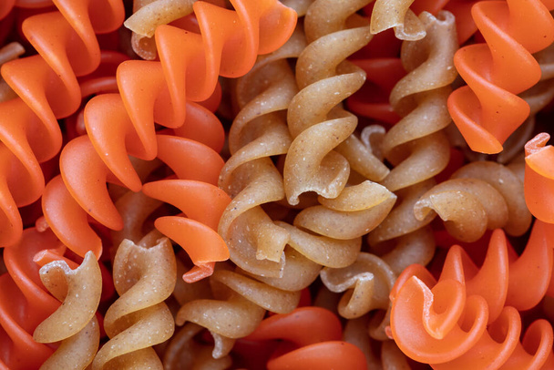 Whole, lentils fusilli pasta background. - Photo, Image