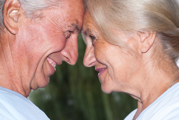 Aged couple smiling - 写真・画像