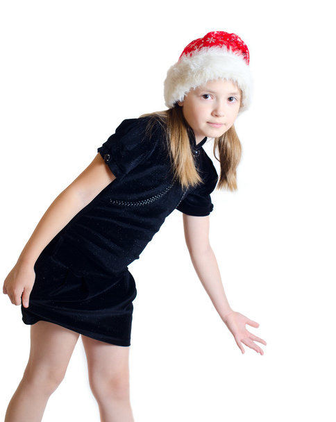Het meisje de tiener in de Kerstman hoed - Foto, afbeelding