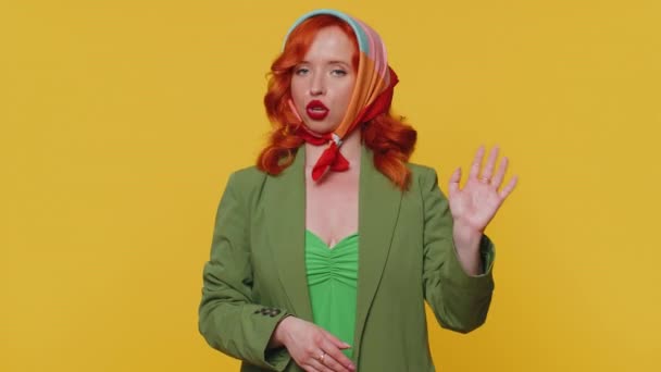 Displeased upset woman reacting to unpleasant awful idea, dissatisfied with bad quality, wave hand, shake head No, dismiss idea, dont like proposal. Young ginger girl alone on yellow studio background - Footage, Video