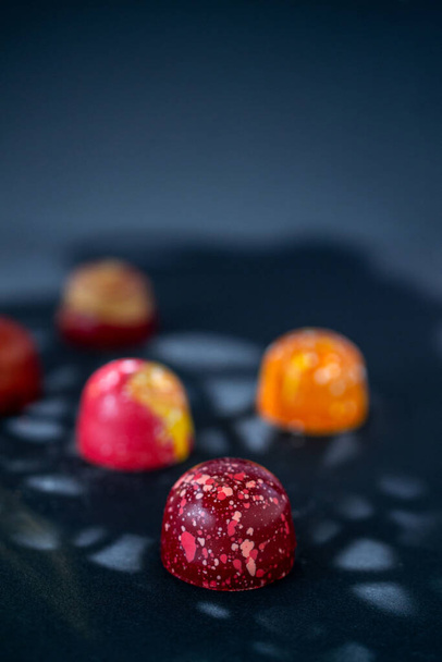 Assortment of painted chocolate pralines. Handcrafted bonbons.Delicious dessert.  - Foto, immagini
