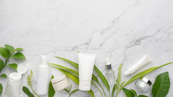 Skincare products with organic natural ingredients on marble background. Packaging of lotion, cream, serum or essence. Natural beauty cosmetology concept. - Foto, Imagen
