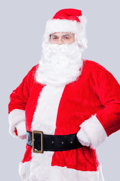 Santa Claus dostosowując jego pasa - Zdjęcie, obraz