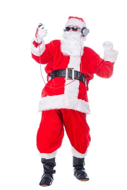 Santa Claus in sunglasses and headphones - Foto, Bild