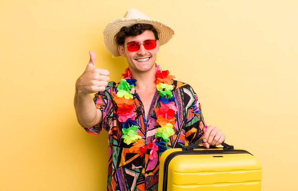 young handsome guy feeling proud,smiling positively with thumbs up. summer holidays concept - Photo, Image