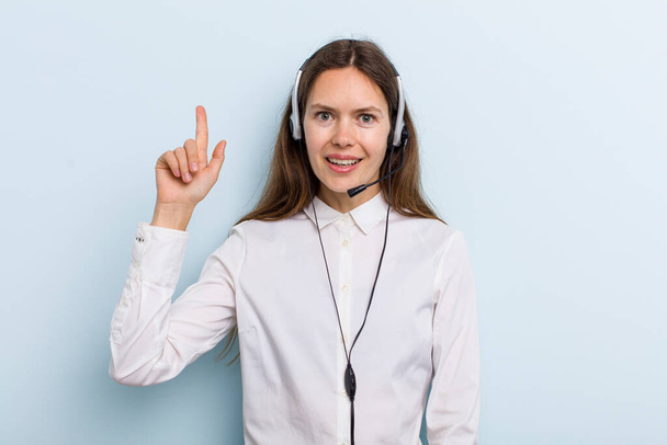 young adult woman feeling like a happy and excited genius after realizing an idea. telemarketer concept - Фото, зображення