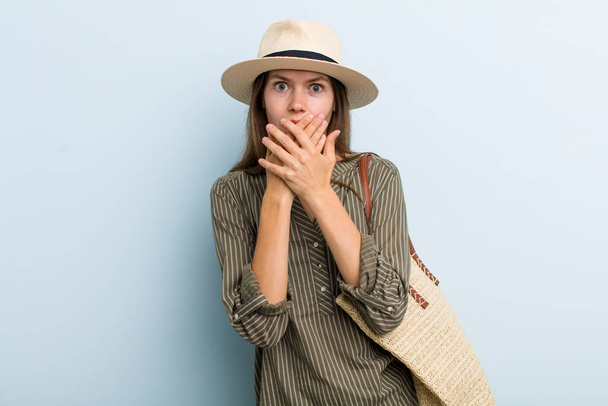 young adult woman covering mouth with hands with a shocked. summer concept - Photo, image