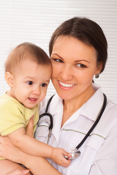 Young doctor with baby - Φωτογραφία, εικόνα