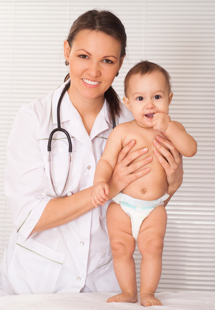 Beautiful doctor and baby - Photo, image