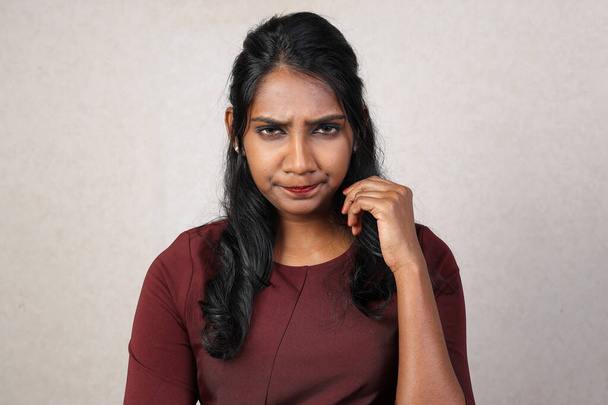 Asian Indian origin dark skin tone beautiful woman facial hand expression looking annoyed grumpy - Photo, Image