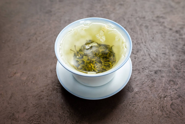 Cup of green tea on a stone table close-up high angle iew - Φωτογραφία, εικόνα