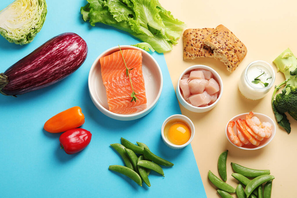 Pescatarian diet on colourful background. Vegetarian diet that includes fish or other aquatic animals. Flat lay, top view, copy space - Foto, afbeelding