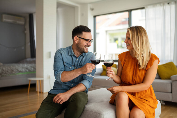 Happy young couple having a romantic date and drinking wine. Couple love romance concept. - Fotoğraf, Görsel