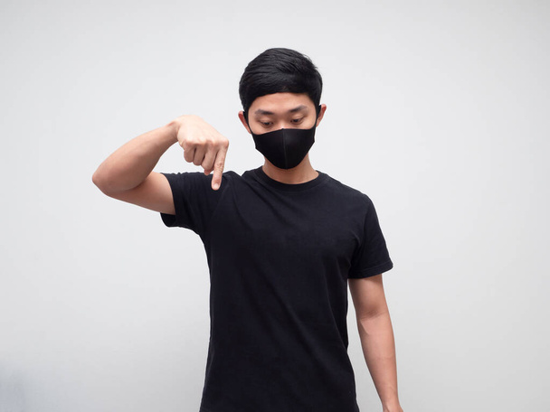 Asian man with protect mask point finger down - Photo, Image