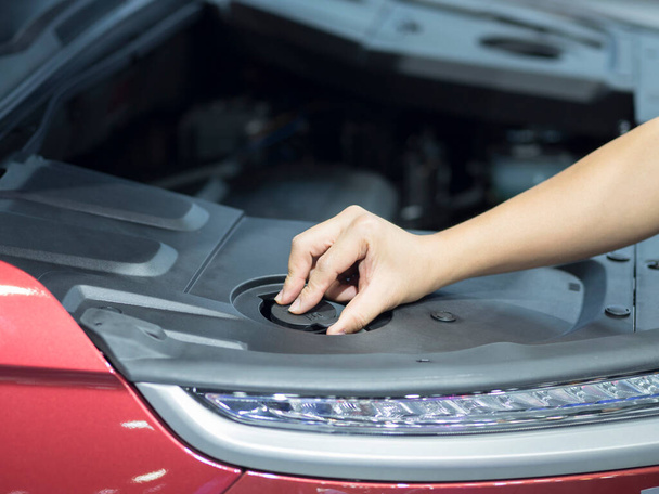 Hand checking equipment interior engine of car - Photo, Image
