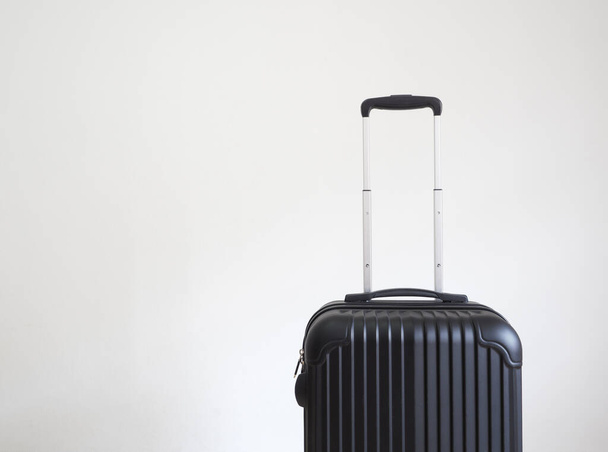 Luggage black color on white isolated holiday concept - Foto, Imagen