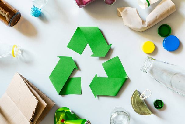 recycling concept - recycling symbol and objects, top view, flatlay - 写真・画像