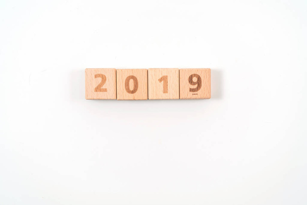 word 2019 on wood cube dices on white background. - Fotoğraf, Görsel