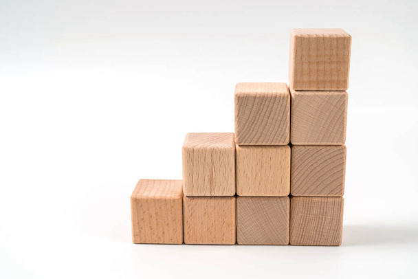 wood cube arrange in pyramid shape ,business concept - Photo, Image