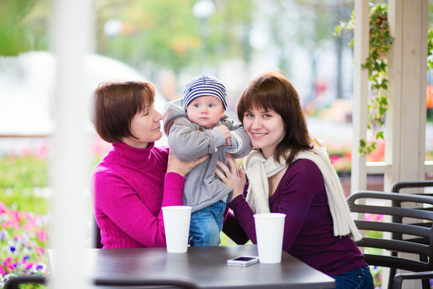 Grandmother, mother and little son in cafe - Photo, Image