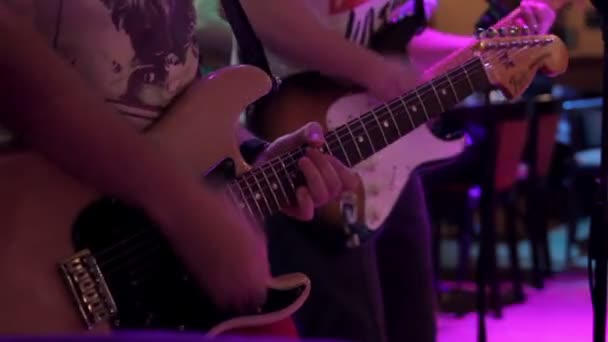 A few guitarists perform at a concert - Materiał filmowy, wideo