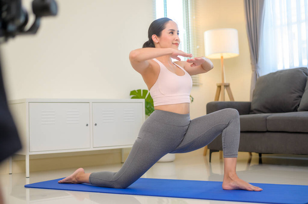 Behind the scenes of Fit young woman doing yoga and meditation at home, sport and healthy lifestyle concept. - Foto, Imagen