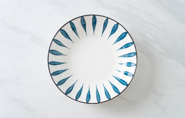 empty beautiful and vintage  ceramic plate with copy space - Fotó, kép