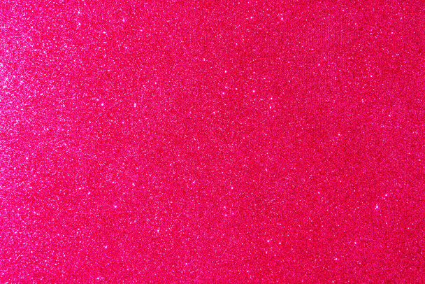 Achtergrond met sprankelingen. Achtergrond met glitter. Glanzend gestructureerd oppervlak. Levendig roze. Gemengde neonverlichting - Foto, afbeelding