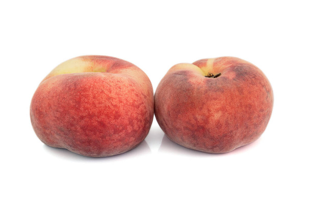 flat peaches isolated on white background - Foto, imagen