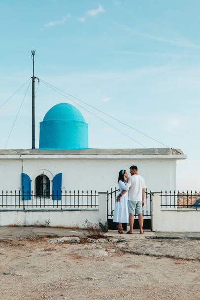 happy couple travelers in front of Church of the Prophet Elias Lefkada island Greece - Valokuva, kuva