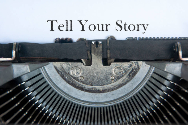 Tell your story text on an old typewriter. - Photo, Image