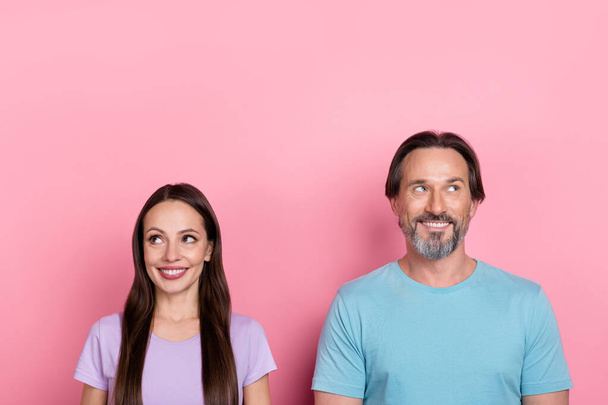 Portrait of two minded dreamy people look empty space wonder isolated on pink color background. - Foto, Imagem