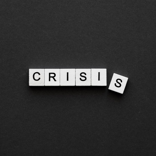 top view crisis word written wooden cubes. High resolution photo - Photo, Image