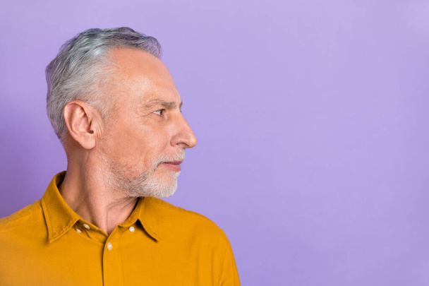 Profile side photo of senior man look empty space barber shop clear isolated over violet color background. - Fotó, kép