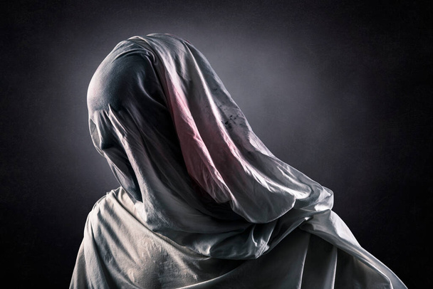 Portrait of a scary ghost over dark misty background - Fotografie, Obrázek