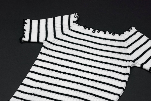 a frizzy knitwear tshit with horizontal black curve and curly line on clear background. - Photo, Image
