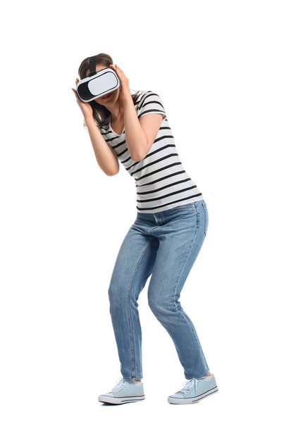 Pretty young woman in VR glasses on white background - Fotografie, Obrázek