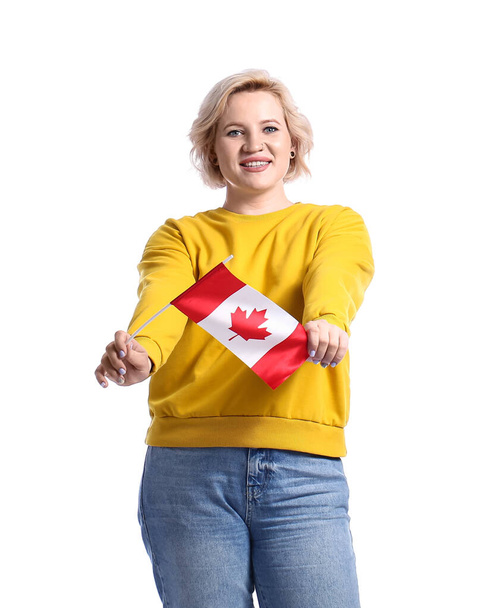 Beautiful blonde woman with Canadian flag on white background - Zdjęcie, obraz