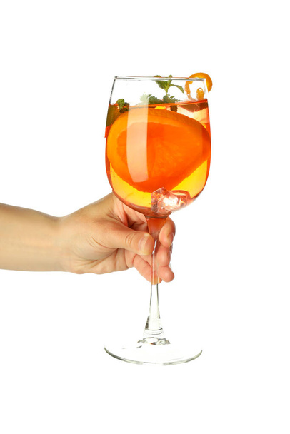 Female hand holds Aperol Spritz, isolated on white background - Fotó, kép