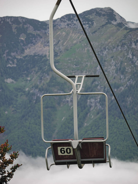 A vertical shot of the seats of a ropeway in Velika Planina, Slovenia - Фото, изображение