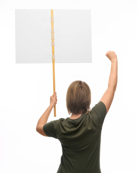 feminism and human rights concept - woman with poster protesting on demonstration over white background - Photo, Image
