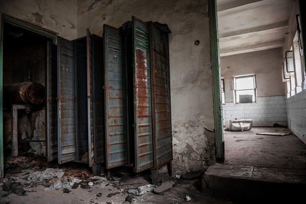 Dark room with steel lockers - Фото, изображение