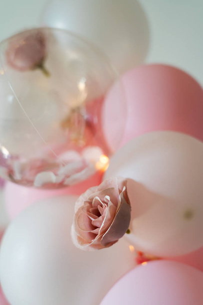 A closeup shot of rose and balloons for party decoration - Fotó, kép