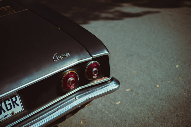 A closeup shot of the exterior of a gray vintage Corvair car - Photo, image